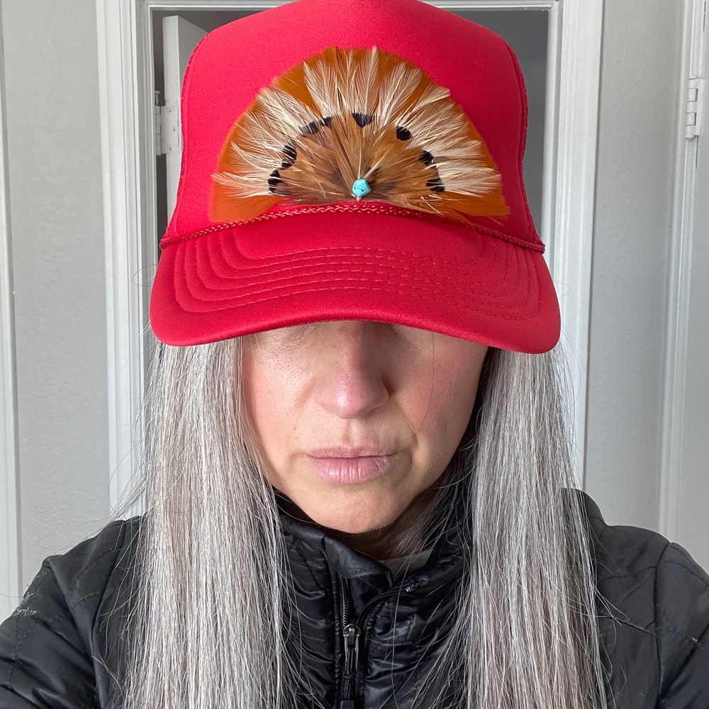Trucker hat with feathers